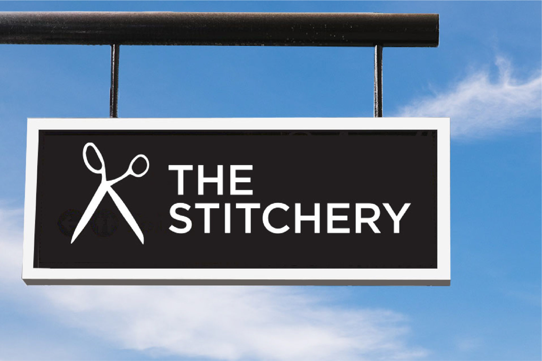 The Stitchery exterior hanging sign, created by Šek Design Studio