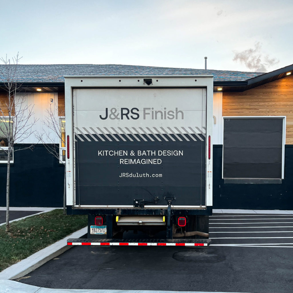 Back view of J&RS vehicle wrap van design, created by Šek Design Studio