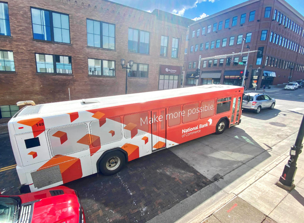 National Bank of Commerce bus wrap, created by Šek Design Studio