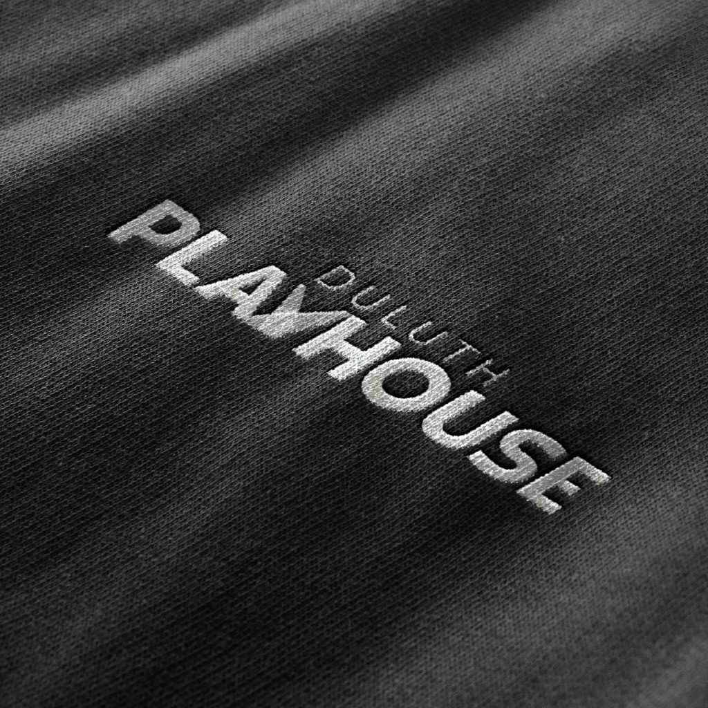 Duluth Playhouse logo on apparel, mock-up created by Šek Design Studio