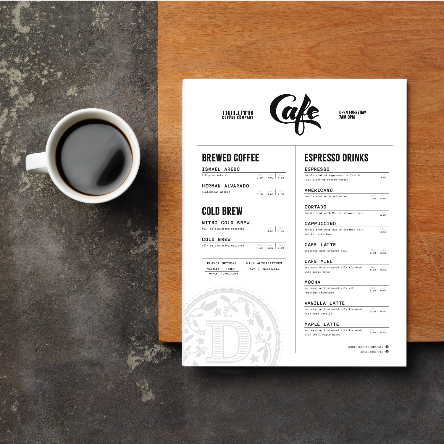 Duluth Coffee Co printed cafe menu design next to cup of coffee, created by Šek Design Studio